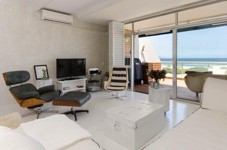 Photo 12 of Dolphin Beach Apartment accommodation in Bloubergstrand, Cape Town with 3 bedrooms and  bathrooms